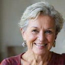 Client testimonial photo of a smiling older woman